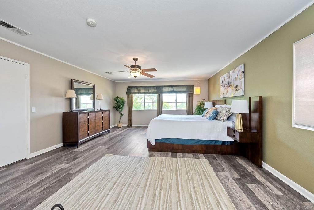345 La Soledad Way Oceanside, CA 92057 - Photo 19 of 34 a bedroom with a large bed and a window