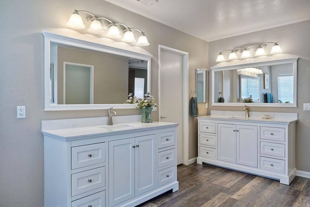 345 La Soledad Way Oceanside, CA 92057 - Photo 24 of 34 a spacious bathroom with double sink a large mirror a vanity and