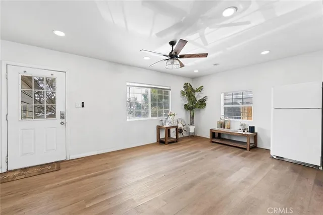a living room with furniture and windows