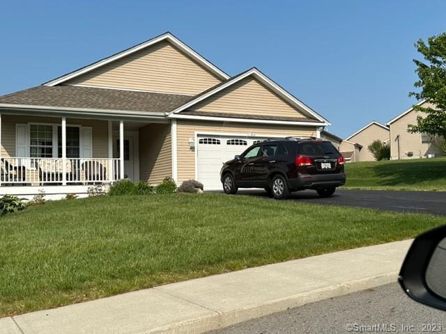 61 Deerwood Drive Killingly, CT 06239 - Photo 14 of 21 front view of a house with a yard