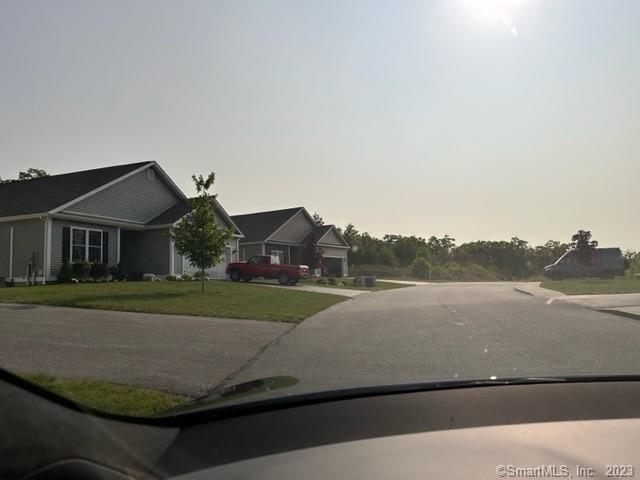 61 Deerwood Drive Killingly, CT 06239 - Photo 18 of 21 a view of houses with outside space and lake view