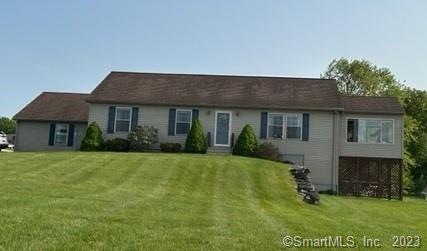 61 Deerwood Drive Killingly, CT 06239 - Photo 4 of 21 a front view of a house with a yard
