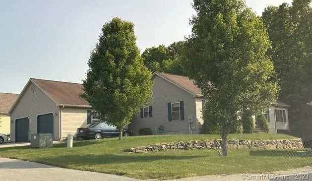 a view of a house with a yard