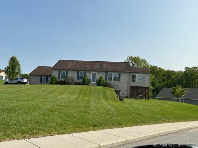 61 Deerwood Drive Killingly, CT 06239 - Photo 8 of 21 a front view of a house with garden