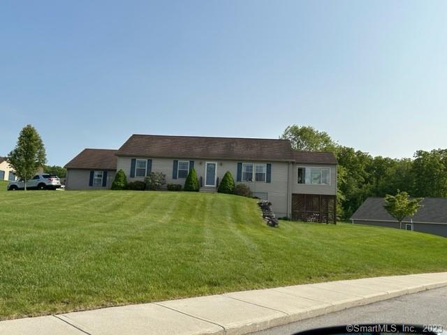 61 Deerwood Drive Killingly, CT 06239 - Photo 9 of 21 a view of a house with a backyard
