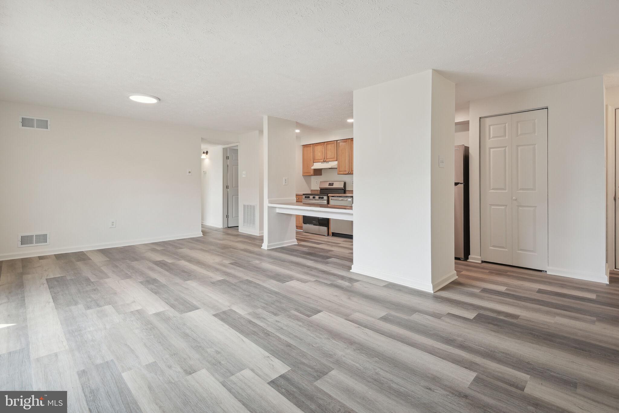 19633 Gunners Branch Road, Unit 523 Germantown, MD 20876 - Photo 4 of 22 New Luxury Vinyl Plank Flooring Throughout