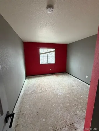 a view of room with a ceiling fan and window