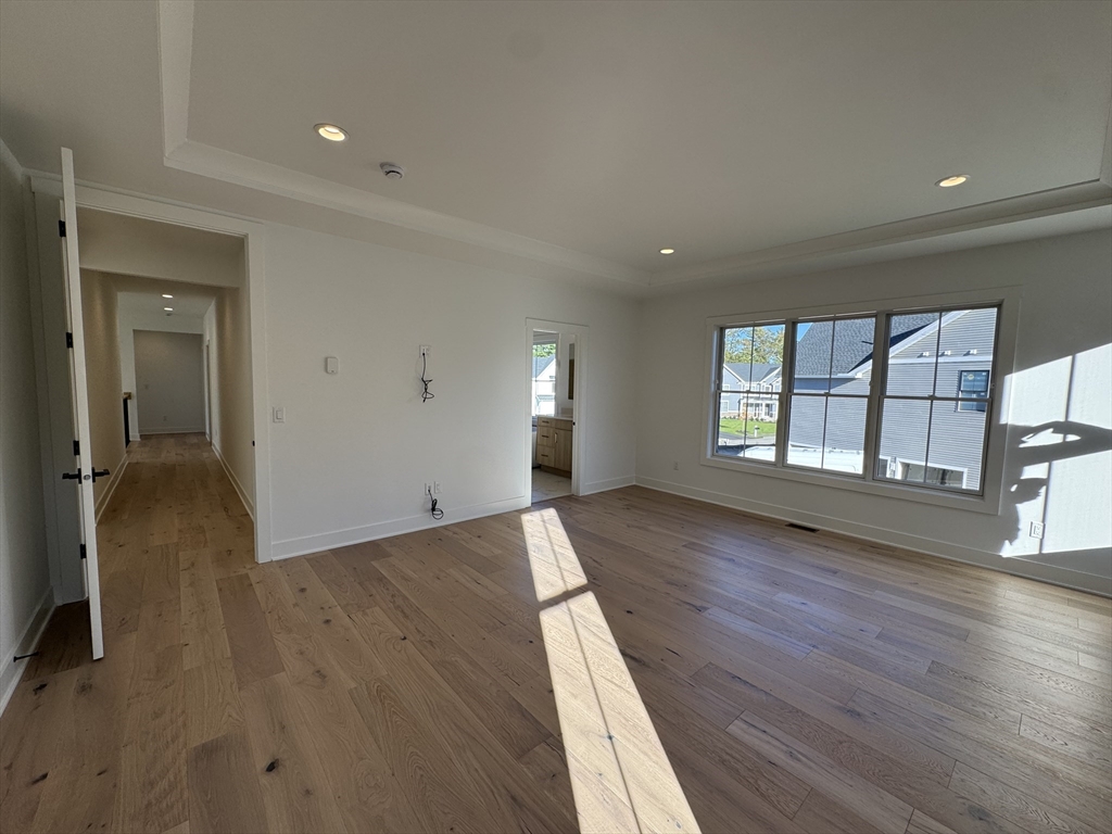 12 Old County Road, Unit 20 Hudson, MA 01749 - Photo 28 of 30 wooden floor in an empty room with a window