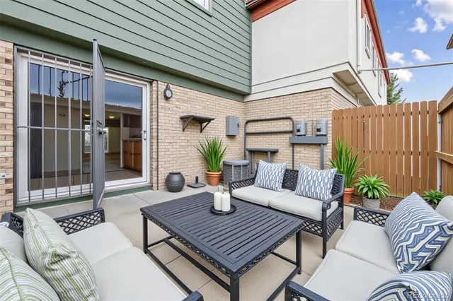 a outdoor space with patio the couches and a potted plant on coffee table with outer view