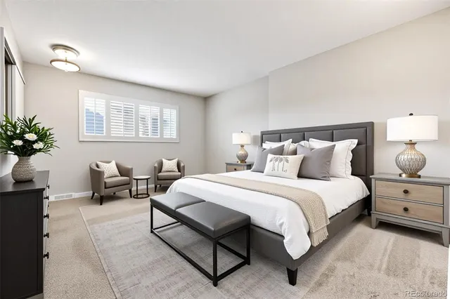 a bed room with a bed and a couch