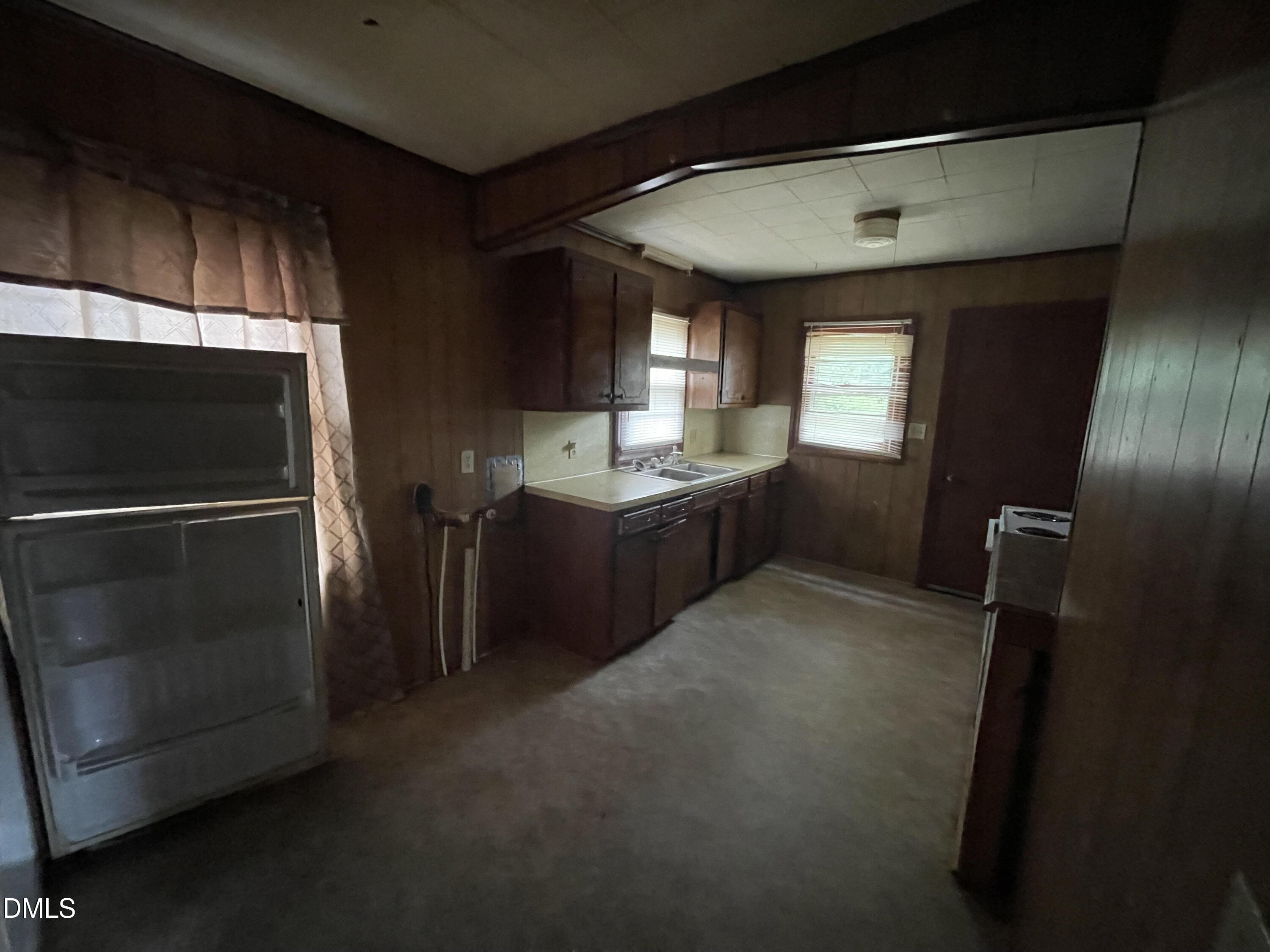 1023 Leasburg Road Roxboro, NC 27573 - Photo 7 of 12 a kitchen with refrigerator and window