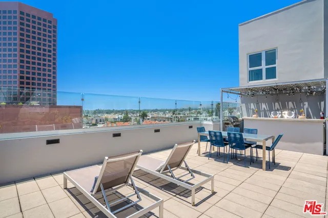 a view of a terrace with furniture and outdoor view