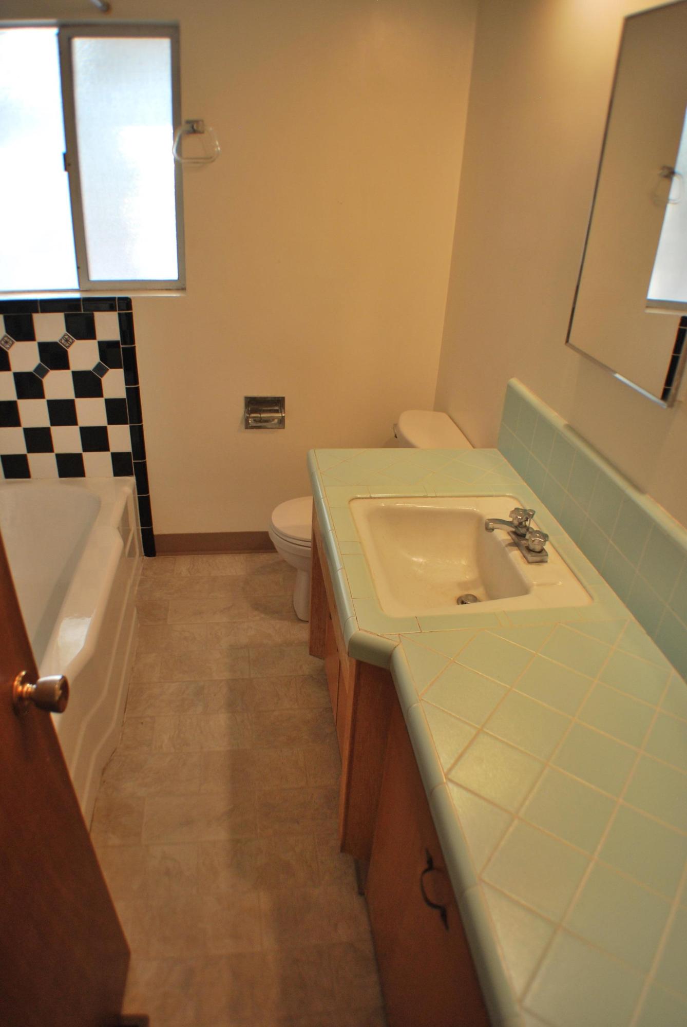 8748 Airport Road Redding, CA 96002 - Photo 10 of 10 a bathroom with a sink and a mirror
