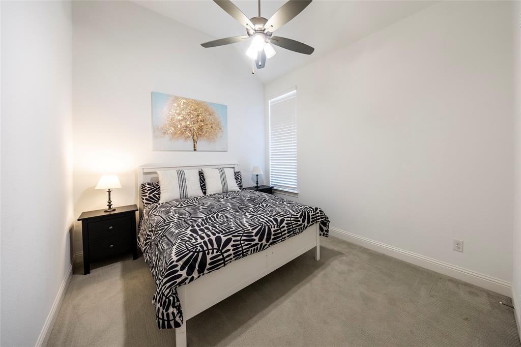 1650 Oakcrest Drive Prosper, TX 75078 - Photo 27 of 40 Bedroom with carpet floors, lofted ceiling, and ceiling fan