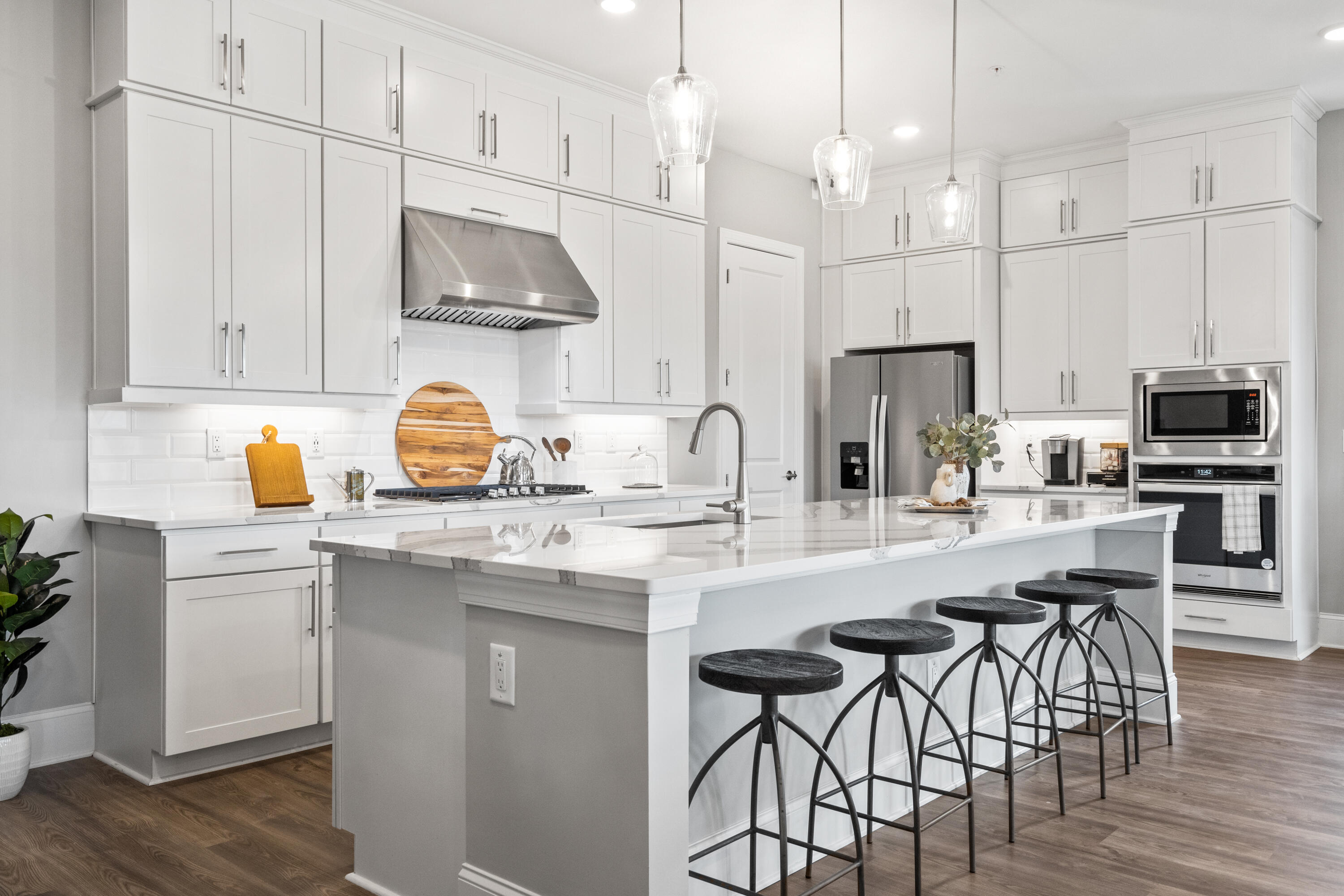 Tbd Tbd Channel Shoal Drive, Unit LOT 12 Santa Rosa Beach, FL 32459 - Photo 4 of 11 a kitchen with stainless steel appliances granite countertop a sink a stove a refrigerator and a dining table with wooden floor