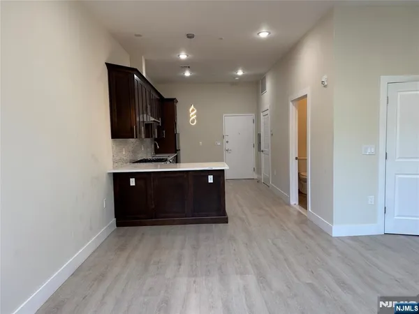 a spacious bathroom with a sink and a mirror
