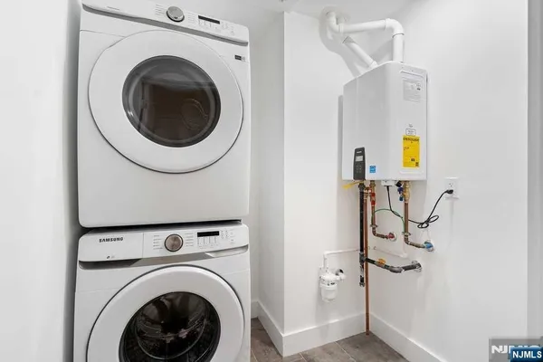 a view of a hallway with washer and dryer