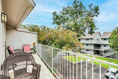a view of balcony with furniture