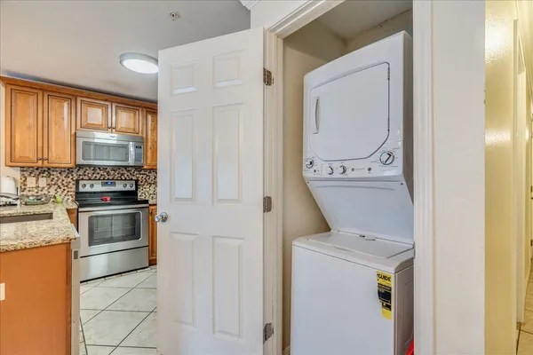 a kitchen with a stove and a microwave