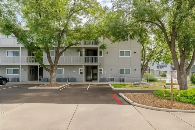 an aerial view of a house with a garden and swimming pool