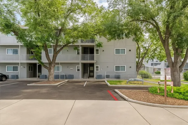 an aerial view of a house with a garden and swimming pool