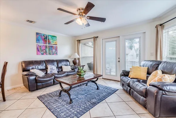 a living room with furniture and a rug