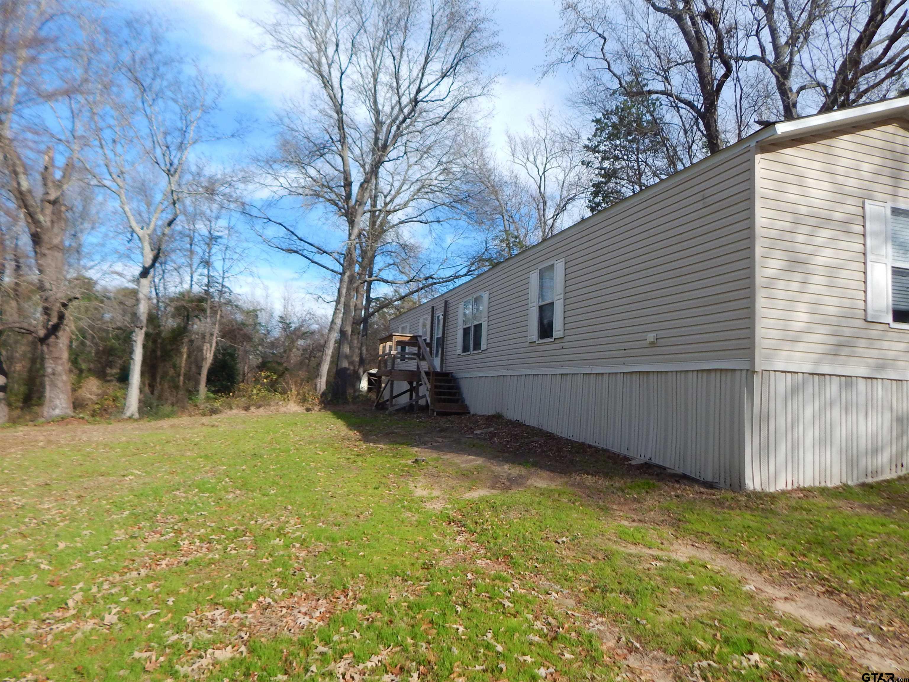 a view of a back yard of the house