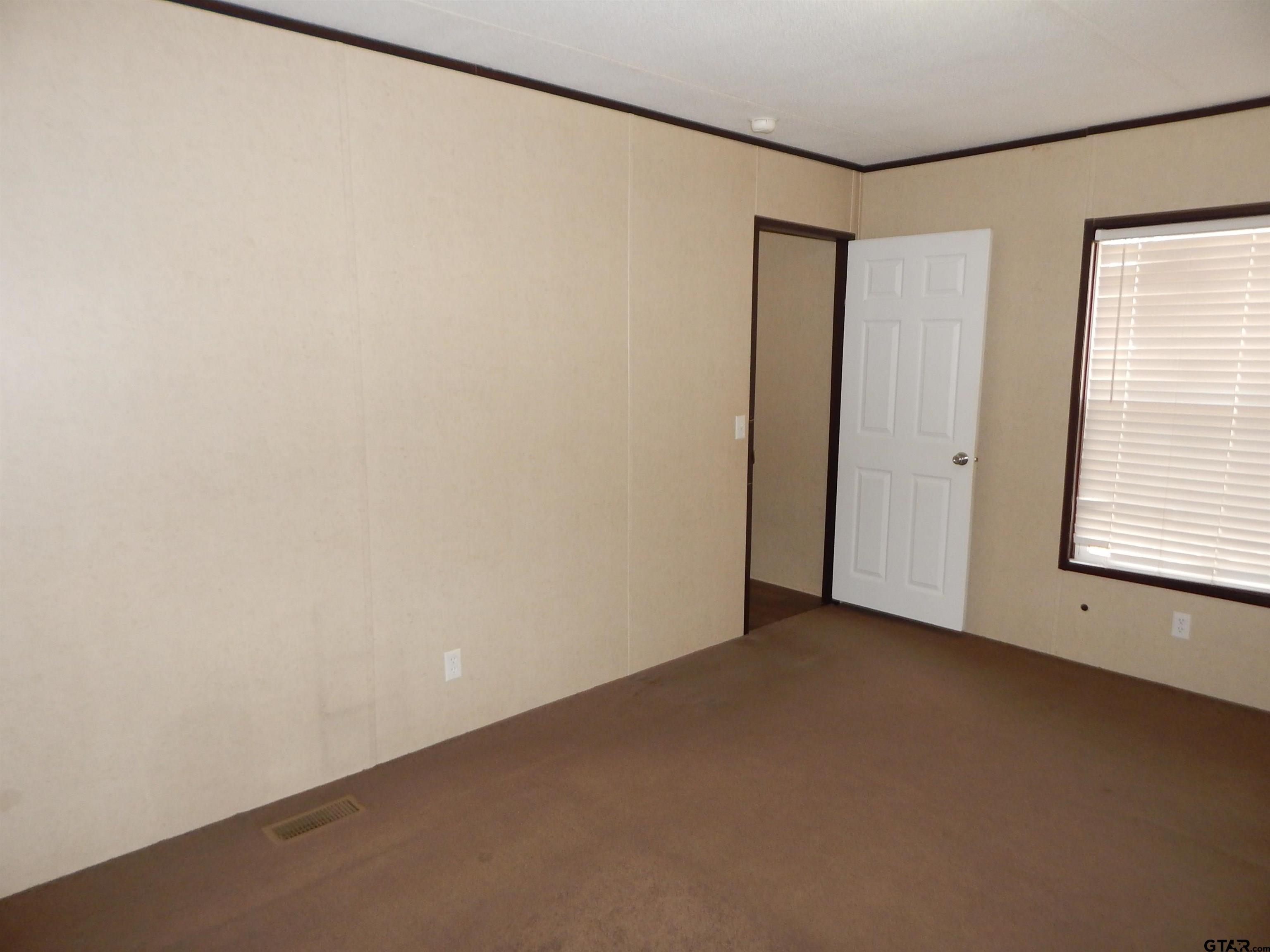 958 Boles Road Gilmer, TX 75645 - Photo 11 of 29 a view of an empty room