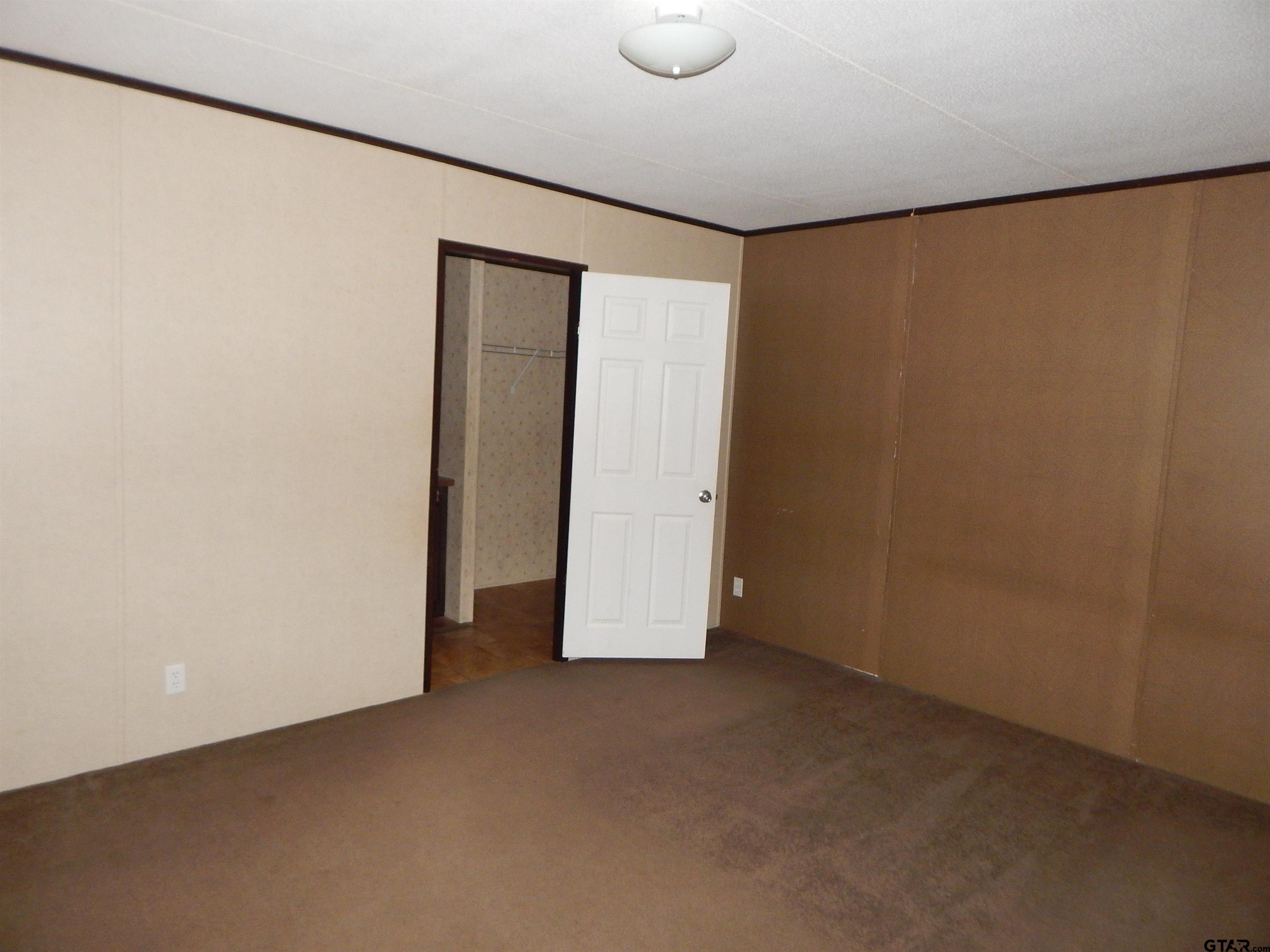 958 Boles Road Gilmer, TX 75645 - Photo 9 of 29 a view of an empty room