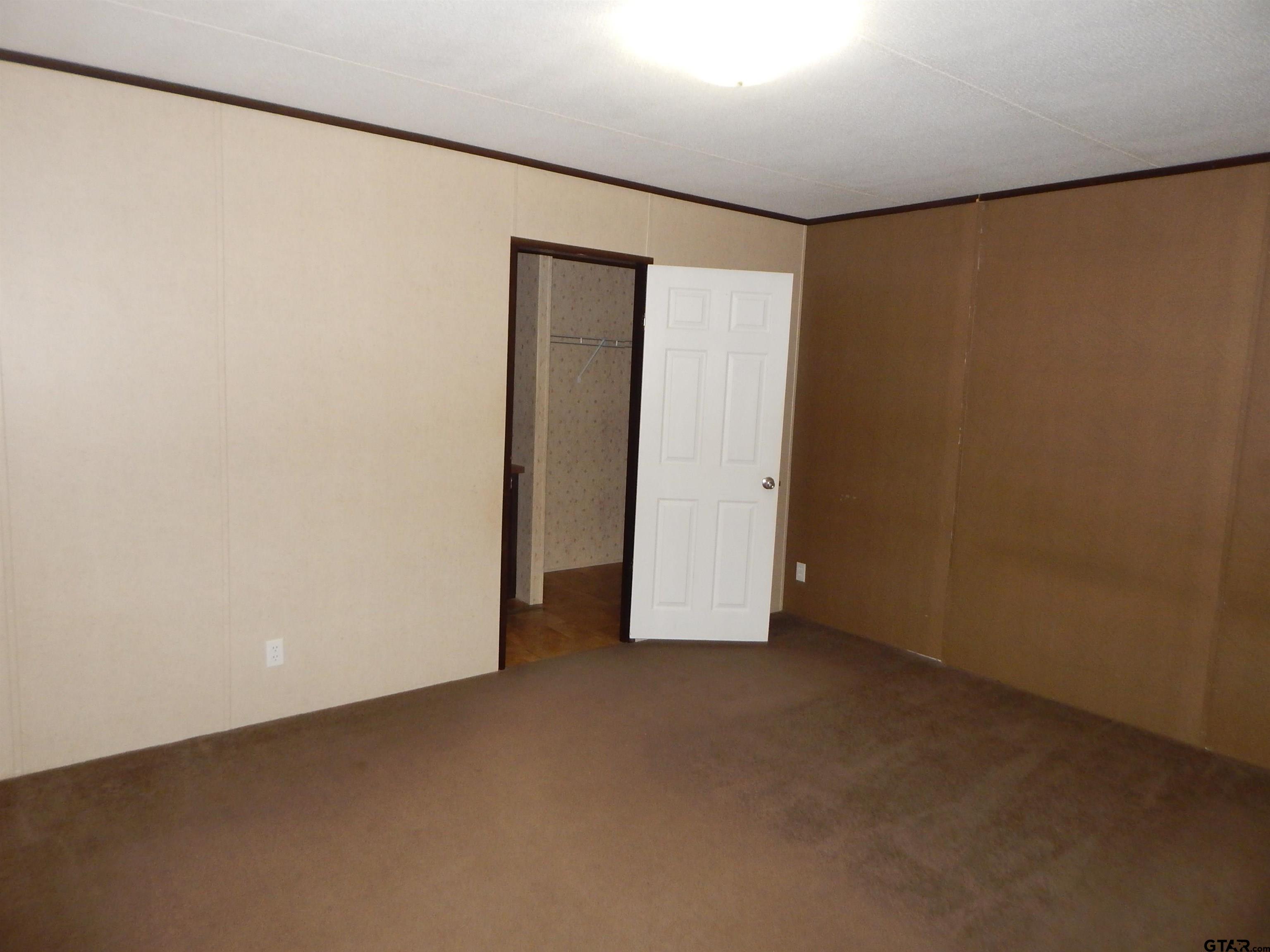 958 Boles Road Gilmer, TX 75645 - Photo 10 of 29 an empty room with closet