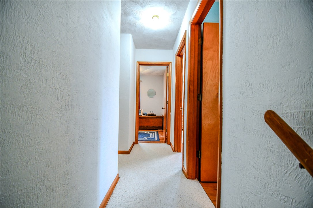 10833 Kendig Road Medway, OH 45341 - Photo 20 of 46 This spacious hallway offers seamless flow, connecting various rooms with timeless appeal and comfort.