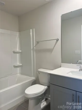 a bathroom with a sink a toilet and a bathtub
