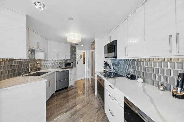 a kitchen with a sink stove and refrigerator