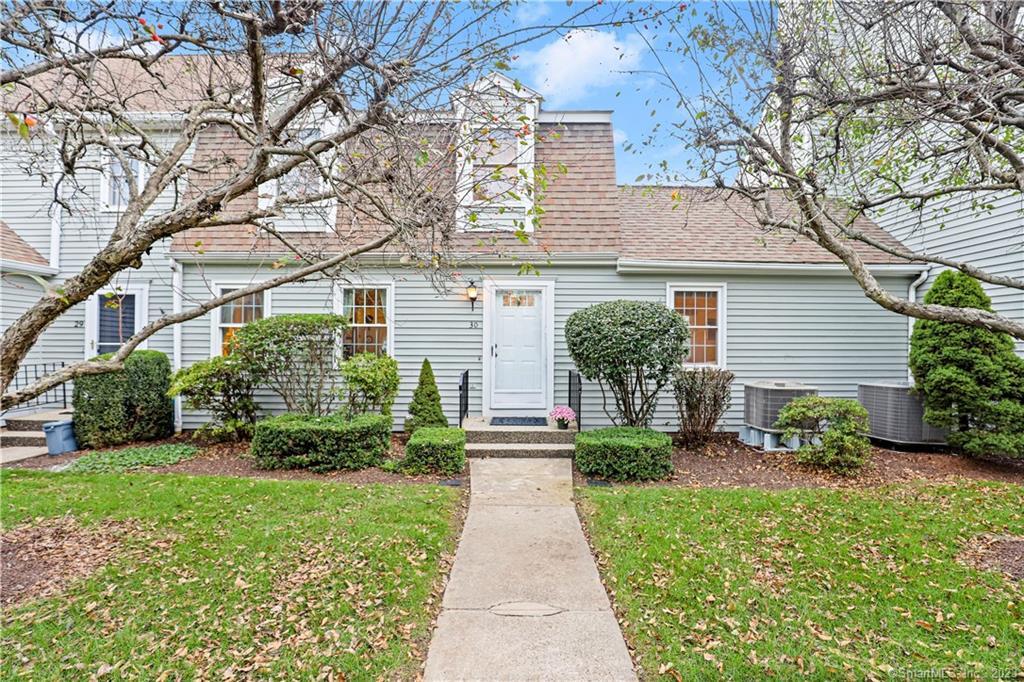 19 Prospect Ridge, Unit 30 Ridgefield, CT 06877 - Photo 1 of 1 a front view of a house with garden