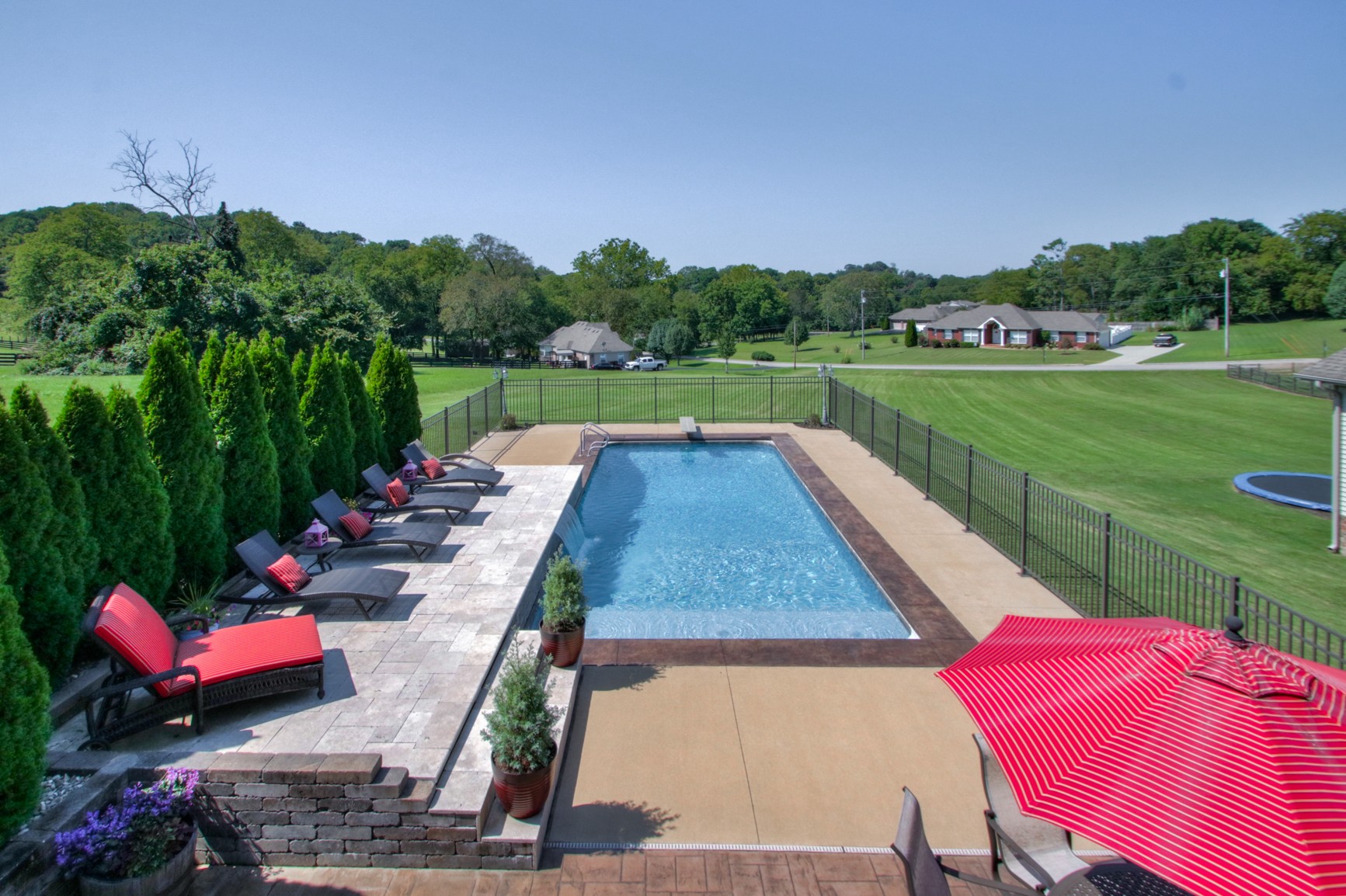 1943 Clara Mathis Road Spring Hill, TN 37174 - Photo 1 of 26 a view of swimming pool and lounge chairs in back yard