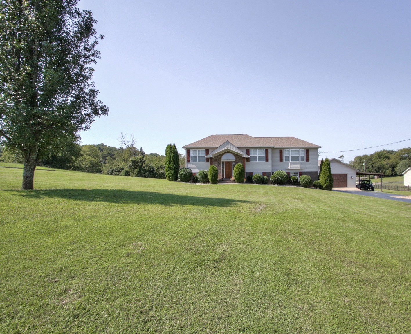 1943 Clara Mathis Road Spring Hill, TN 37174 - Photo 2 of 26 a house view with a garden space