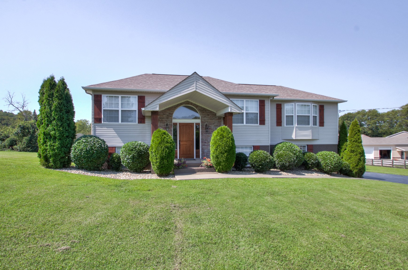 1943 Clara Mathis Road Spring Hill, TN 37174 - Photo 3 of 26 a front view of a house with a yard