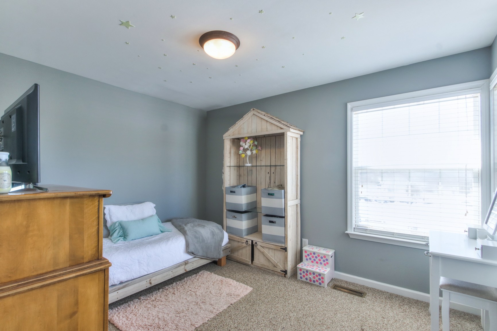 1943 Clara Mathis Road Spring Hill, TN 37174 - Photo 21 of 26 a bedroom with a bed and wooden floor