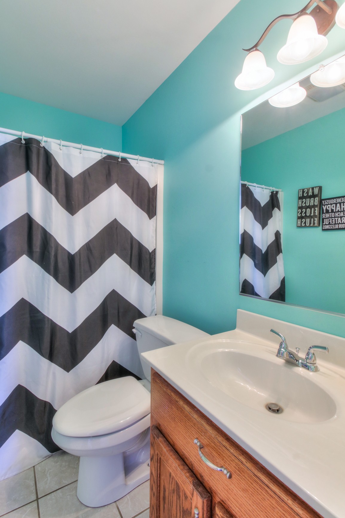 1943 Clara Mathis Road Spring Hill, TN 37174 - Photo 22 of 26 a bathroom with a sink and mirror