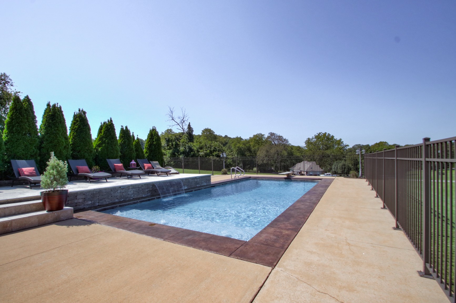1943 Clara Mathis Road Spring Hill, TN 37174 - Photo 7 of 26 a view of swimming pool and trees in the background