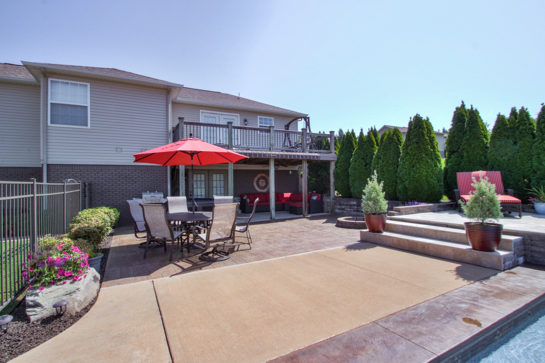1943 Clara Mathis Road Spring Hill, TN 37174 - Photo 8 of 26 a view of a patio with a table and chairs under an umbrella