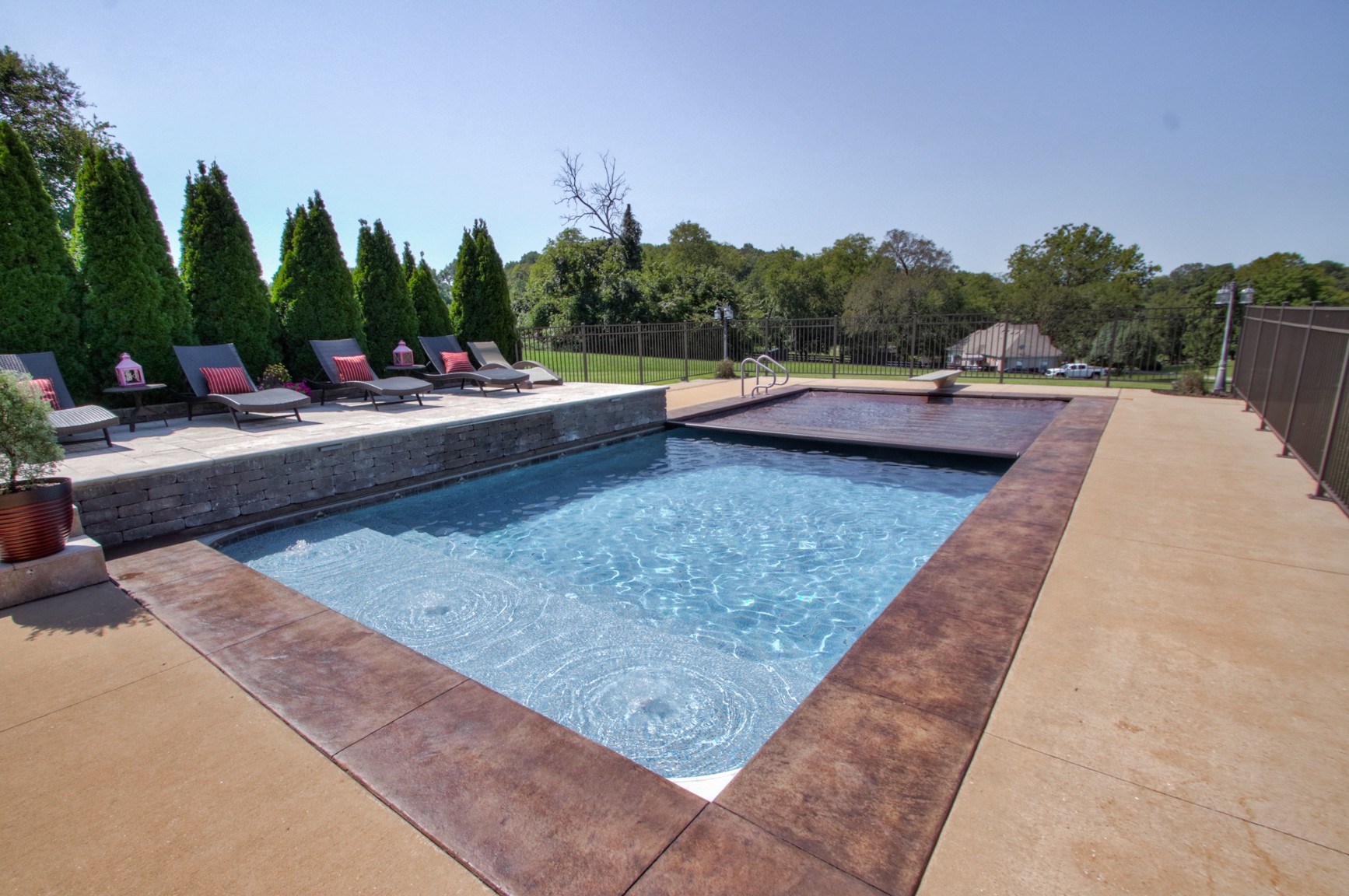 1943 Clara Mathis Road Spring Hill, TN 37174 - Photo 10 of 26 a view of swimming pool with sitting area and trees in the background