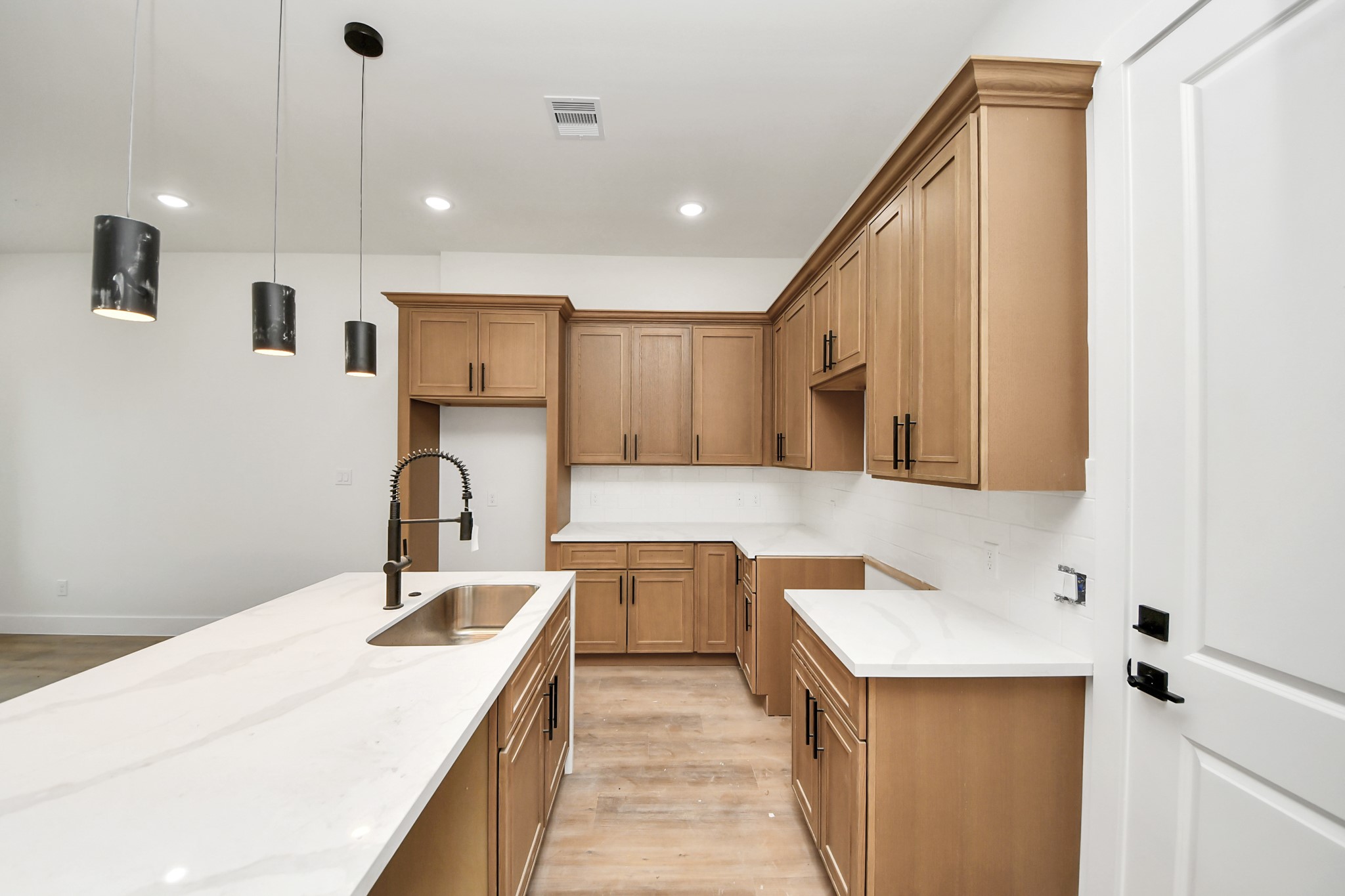 8206 Colonial Lane Houston, TX 77051 - Photo 11 of 31 a kitchen with a sink refrigerator and microwave