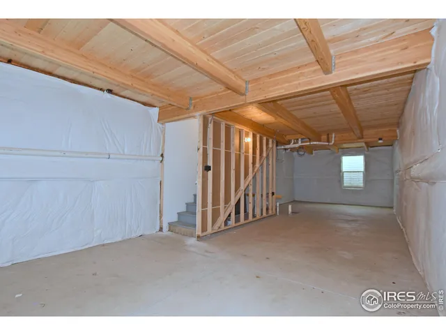a view of a room with wooden stairs