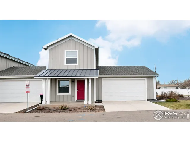 a front view of a house with a garage