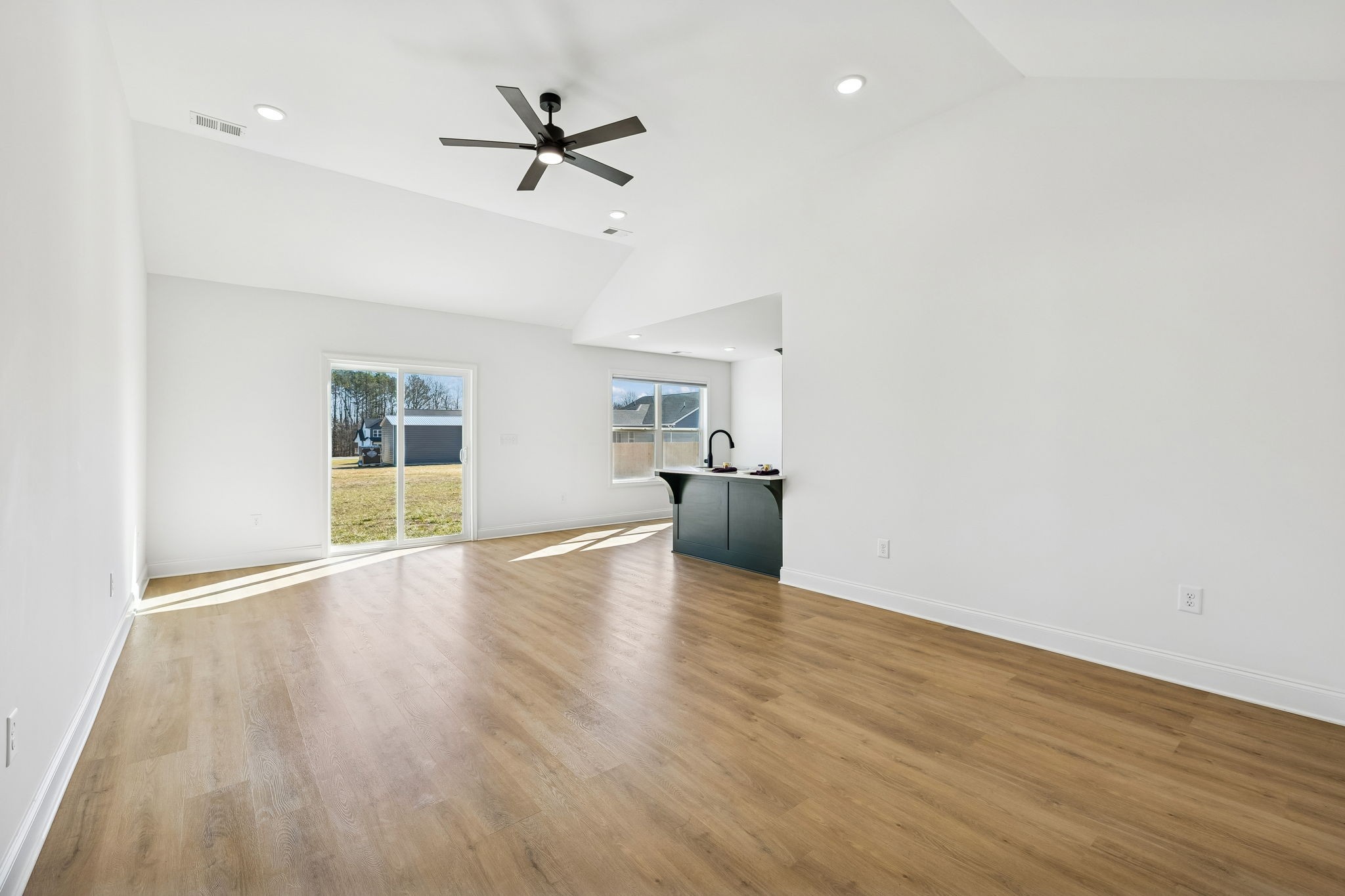 1306 Angus Way Greenbrier, TN 37073 - Photo 13 of 36 a view of empty room with wooden floor and ceiling fan