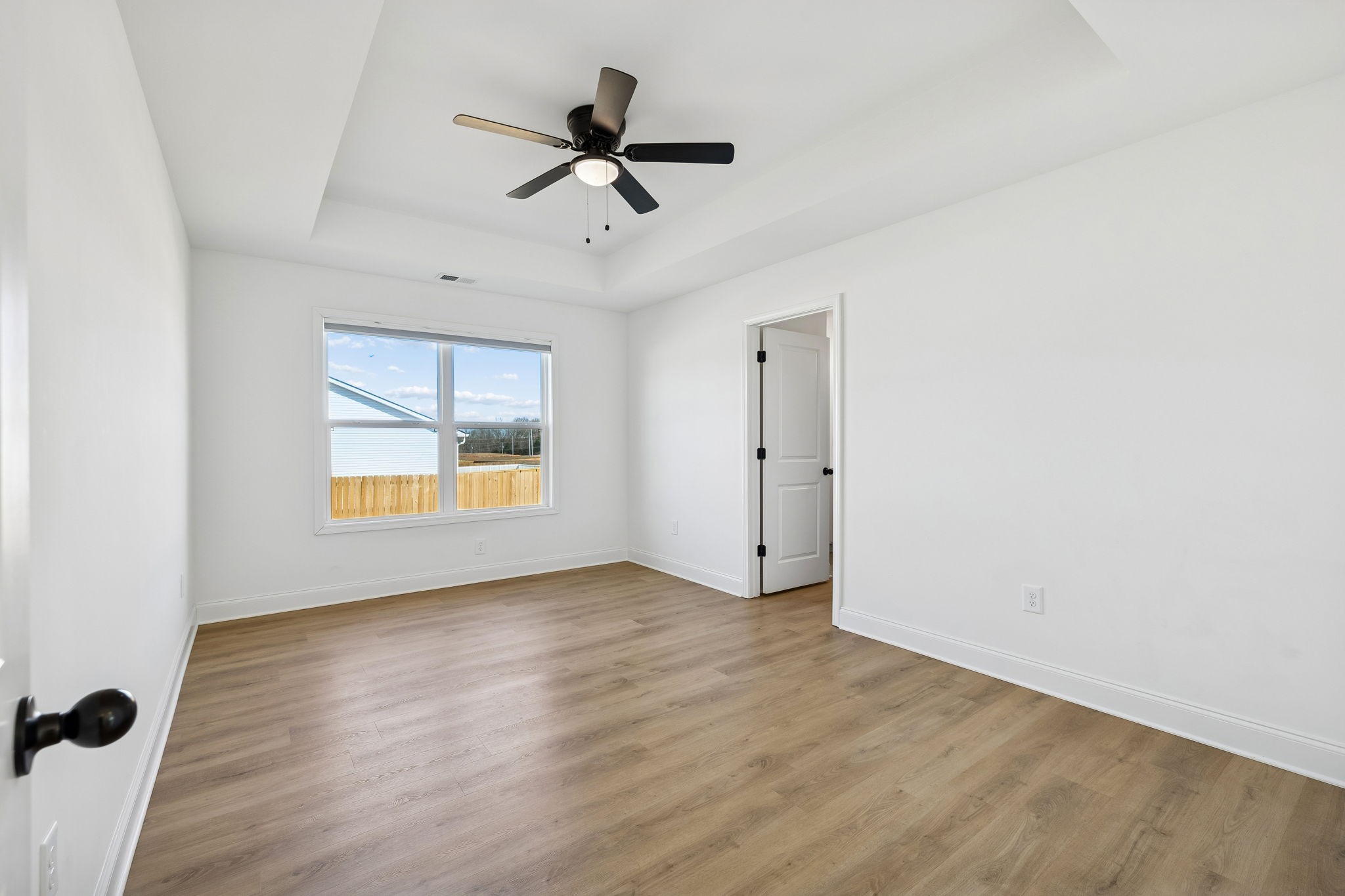 1306 Angus Way Greenbrier, TN 37073 - Photo 14 of 36 a view of empty room with wooden floor and fan