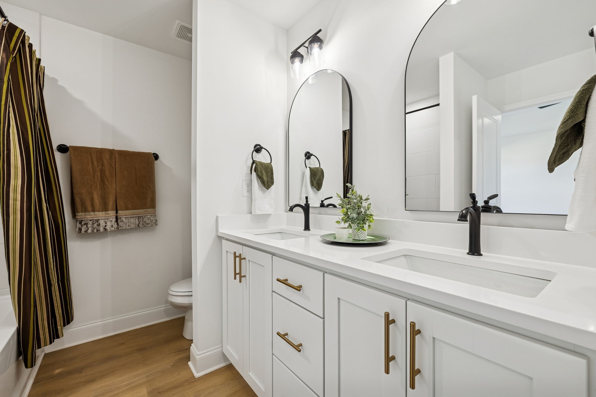 1306 Angus Way Greenbrier, TN 37073 - Photo 18 of 36 a bathroom with a double vanity sink and a mirror