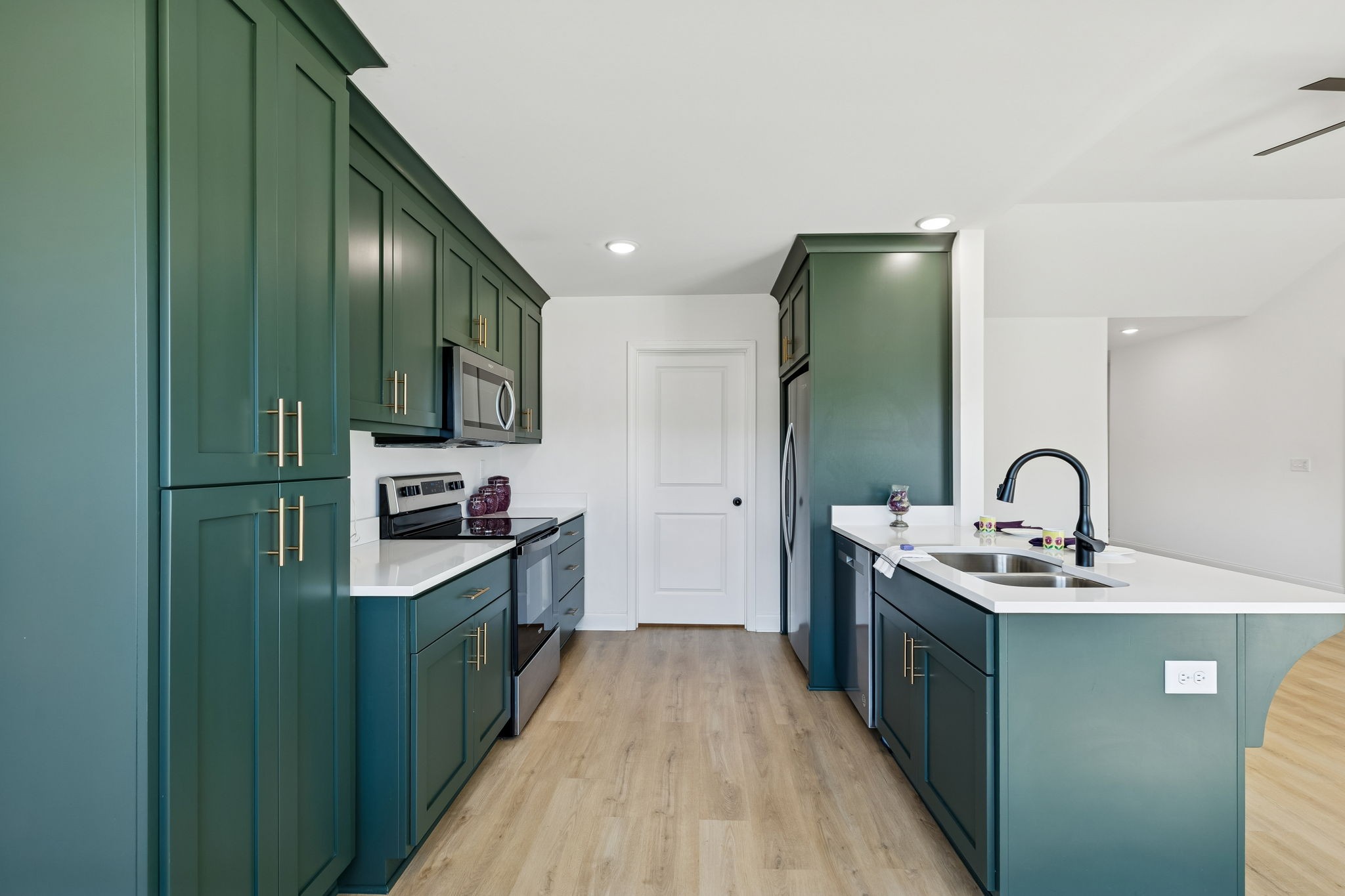 1306 Angus Way Greenbrier, TN 37073 - Photo 26 of 36 a kitchen with stainless steel appliances a sink stove and cabinets