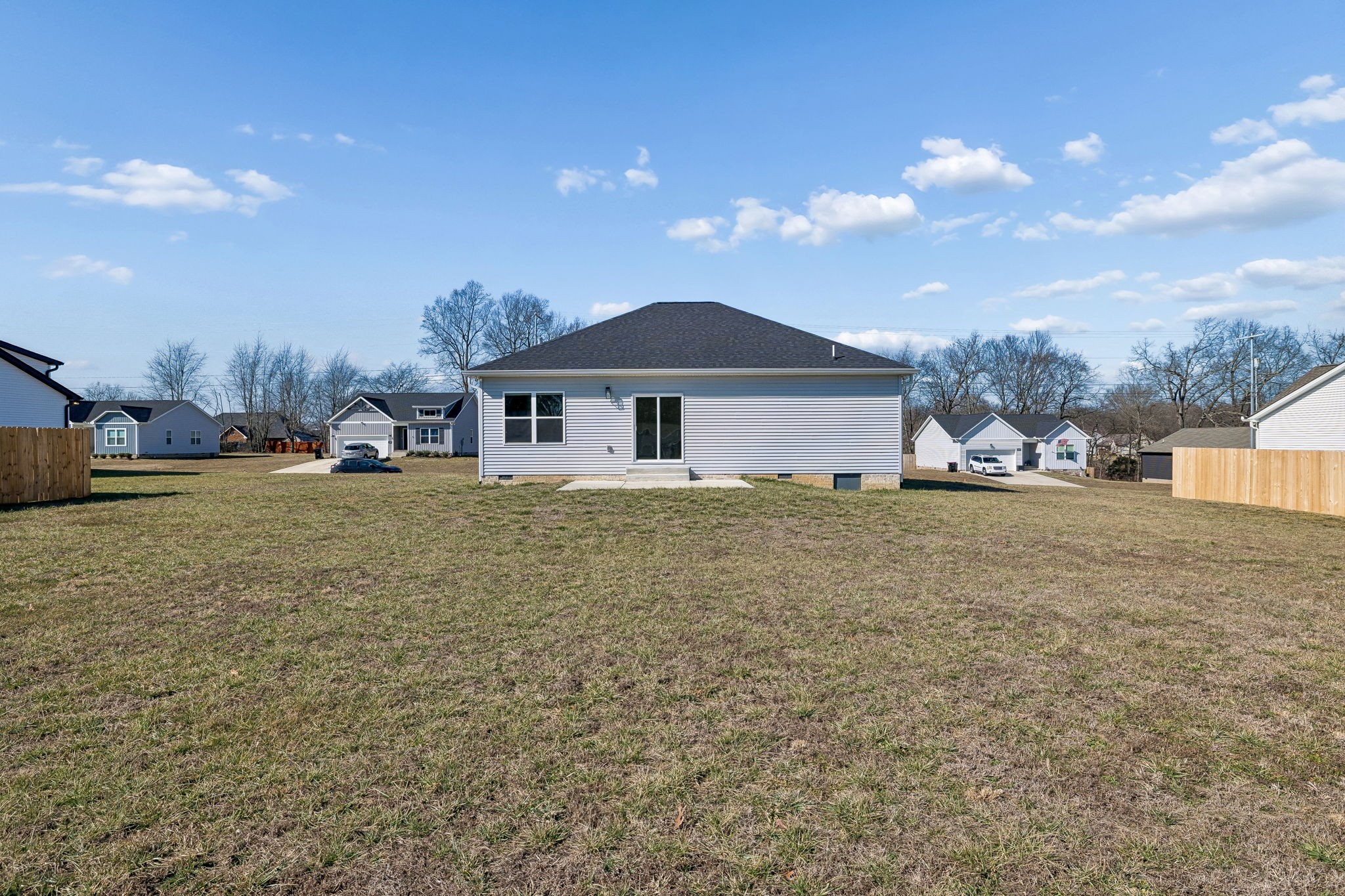 1306 Angus Way Greenbrier, TN 37073 - Photo 33 of 36 a large house with a big yard and large trees